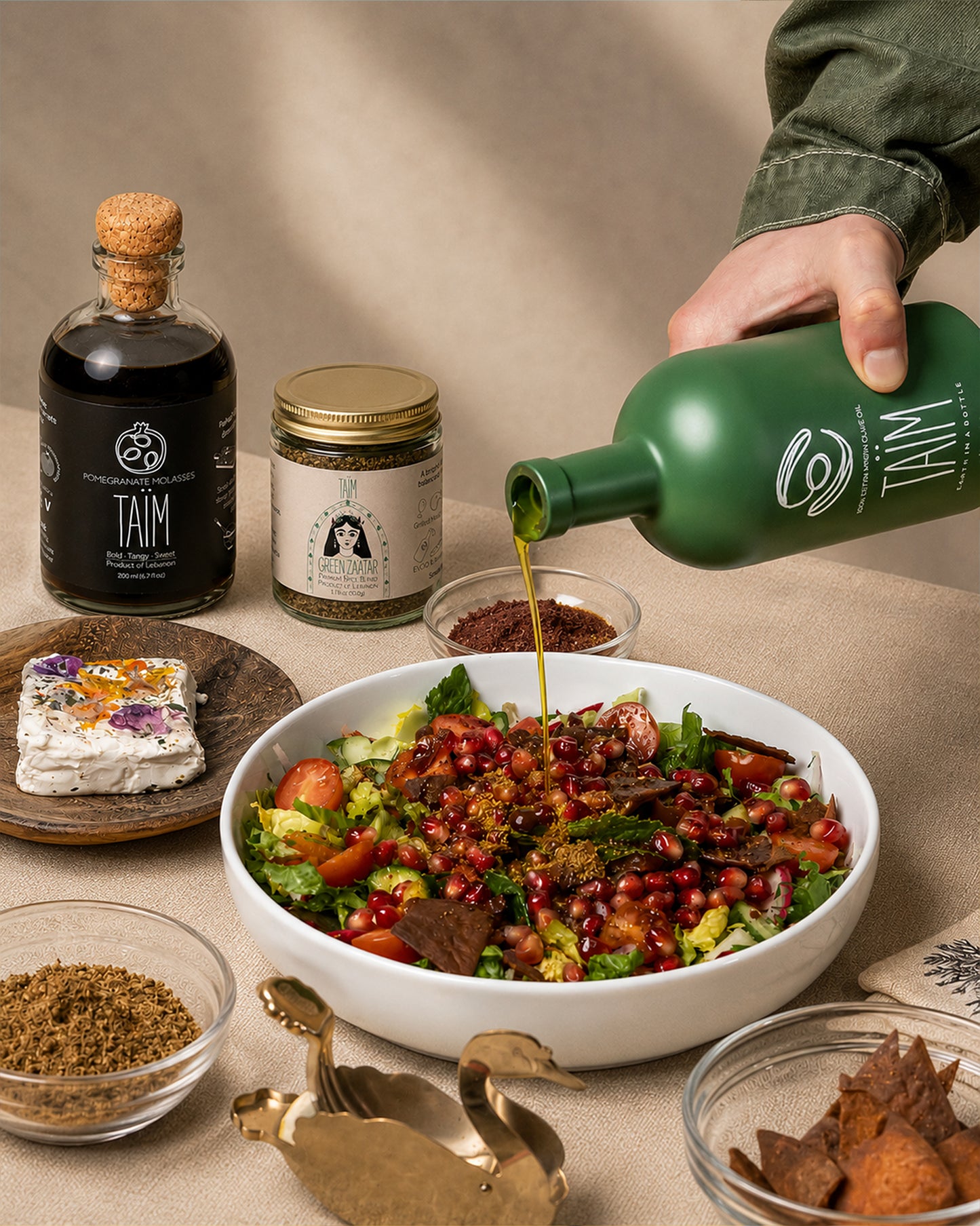 The Taïm Trio Gift Set featuring Lebanese extra virgin olive oil, traditional za'atar blend, and pomegranate molasses