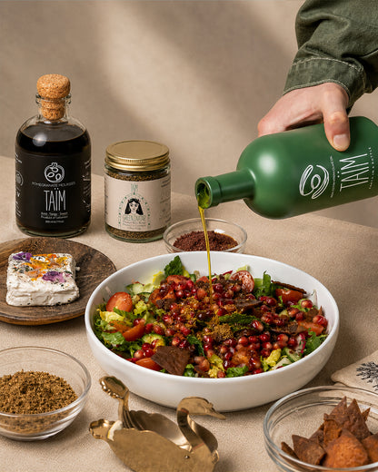 The Taïm Trio Gift Set featuring Lebanese extra virgin olive oil, traditional za'atar blend, and pomegranate molasses