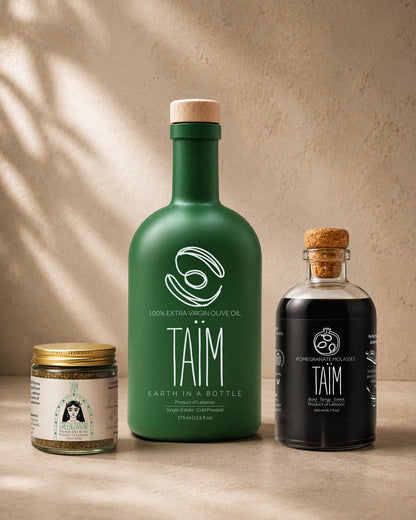 The Taïm Trio Gift Set featuring Lebanese extra virgin olive oil, traditional za'atar blend, and pomegranate molasses